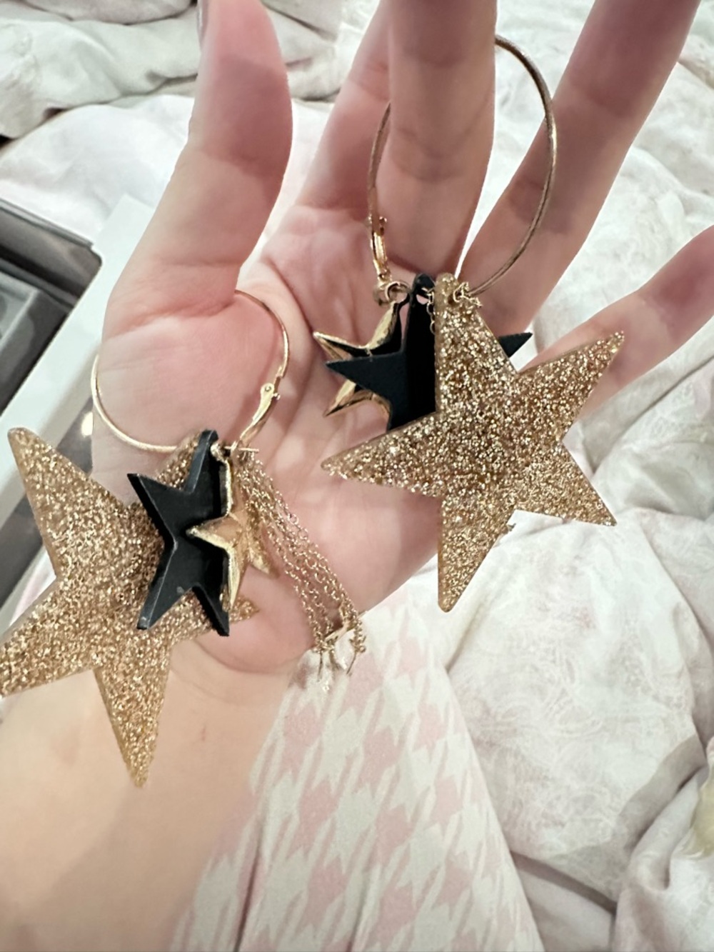 Gold Glitter Star Hoop Earrings with Black Star Accents